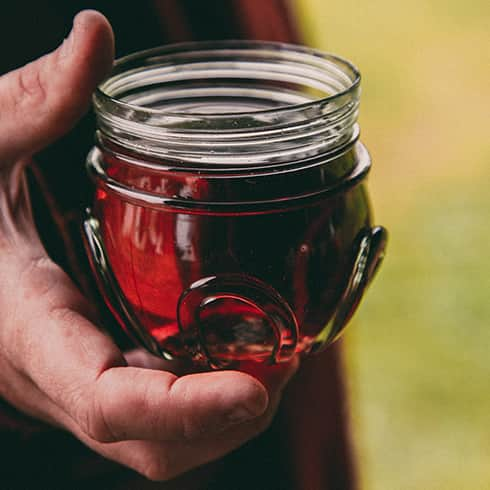 The image shows a viking glass filled with red wine.