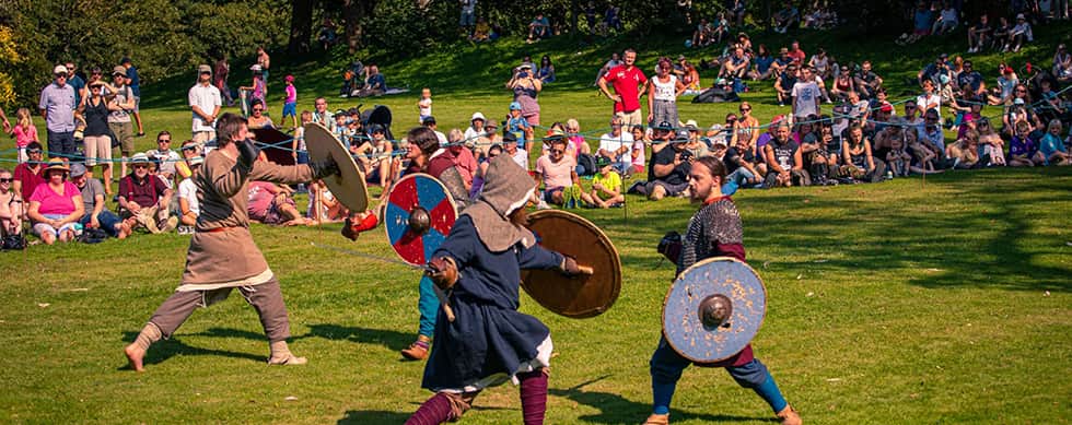 The image shows warriors fighting a 'Battle of Champions' at Rockingham Castle in 2019