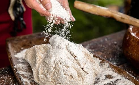 The image shows viking bread making.