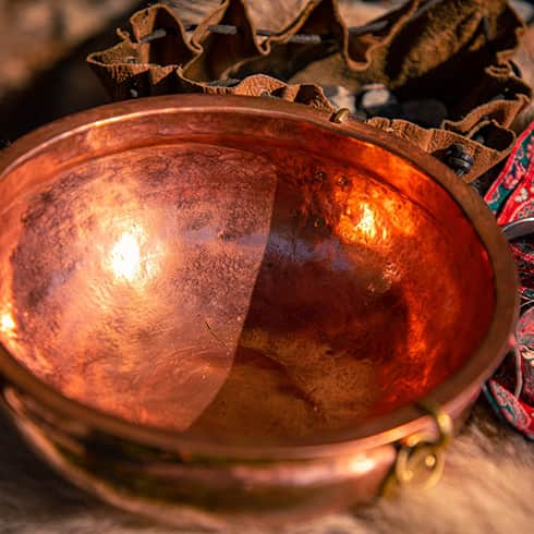 The image shows a copper wash basin