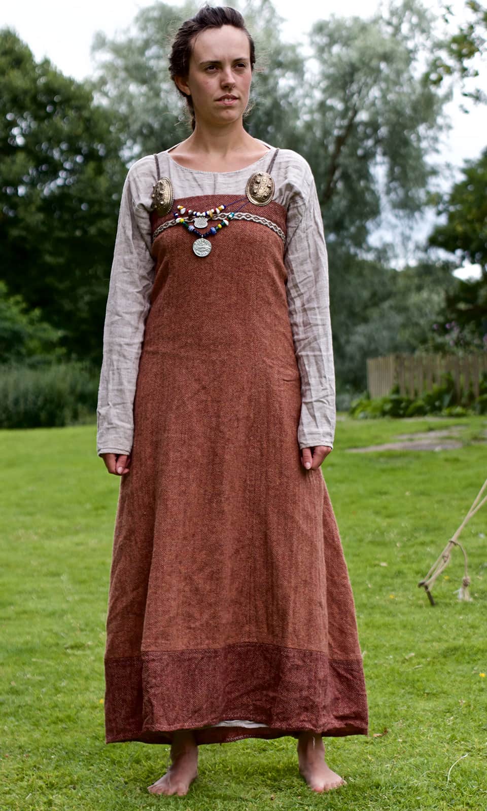 The image shows a Viking woman dressed in elaborate clothes
