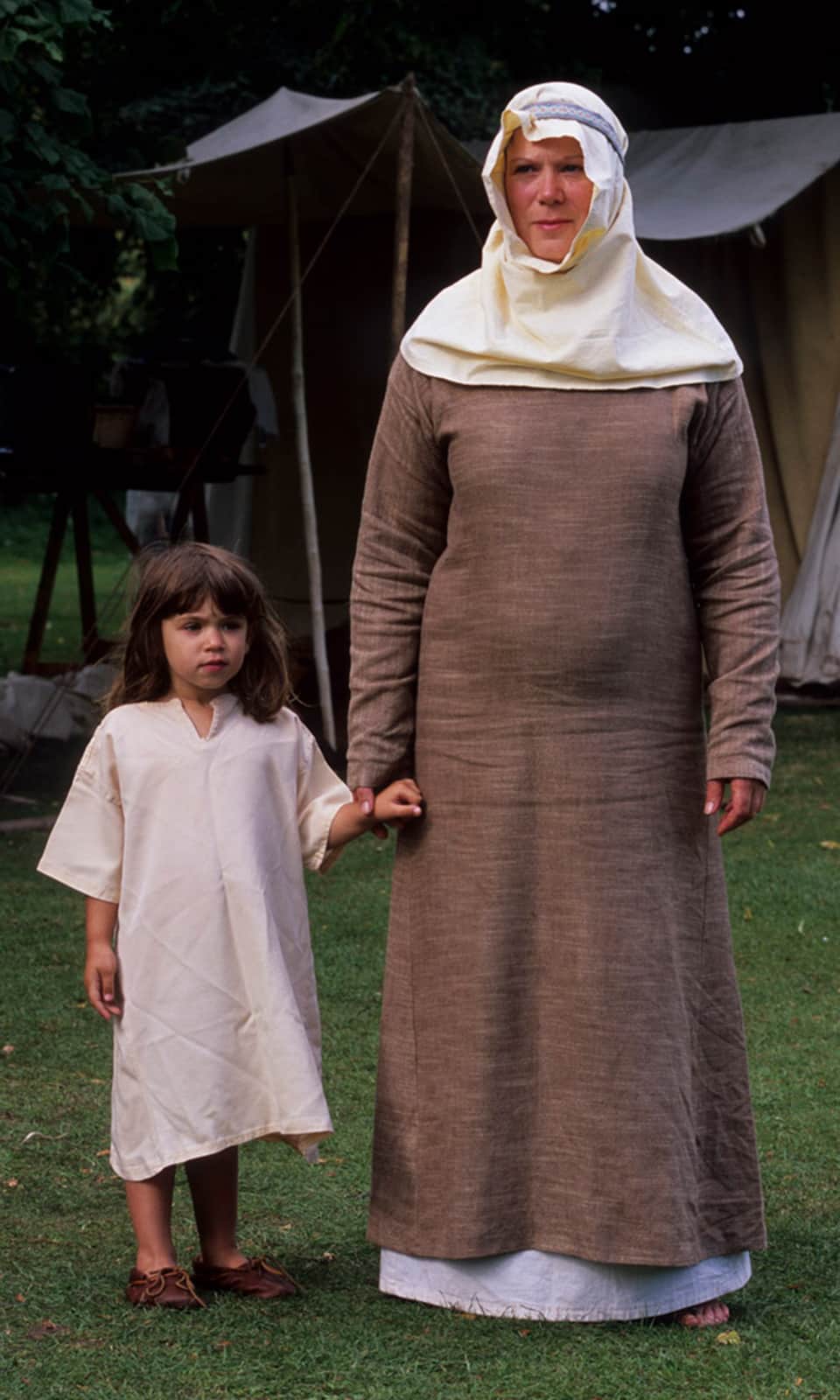 The image shows a wom,an and her daughter, dressed in simple viking clothing